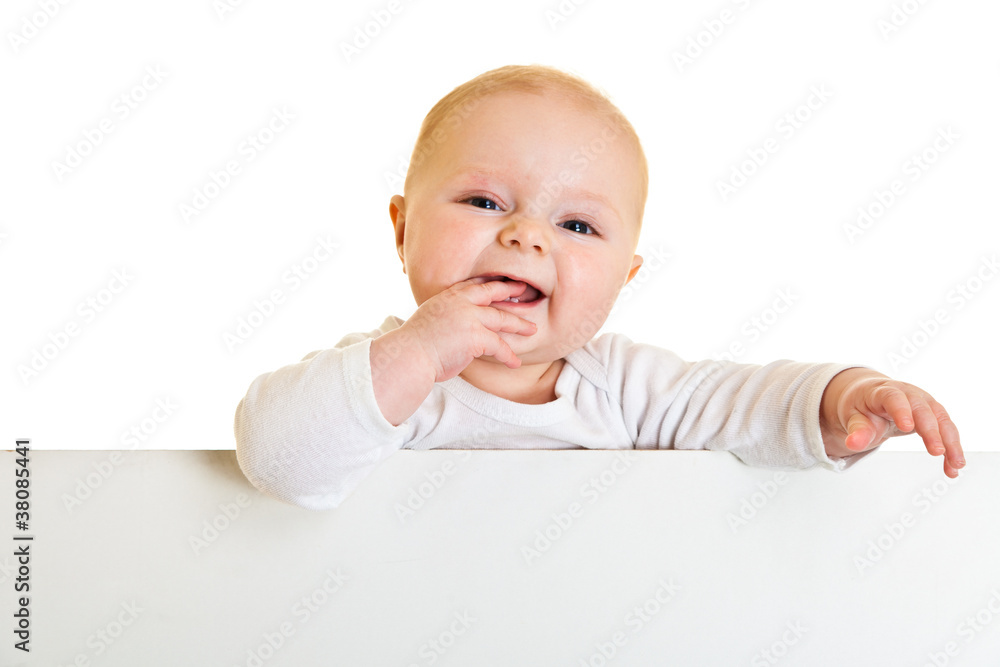 Isolated beaufiful caucasian infant baby behind whiteboard Isolated beaufiful caucasian infant baby behind whiteboard