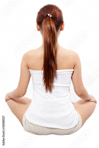 woman meditating taken from behind
