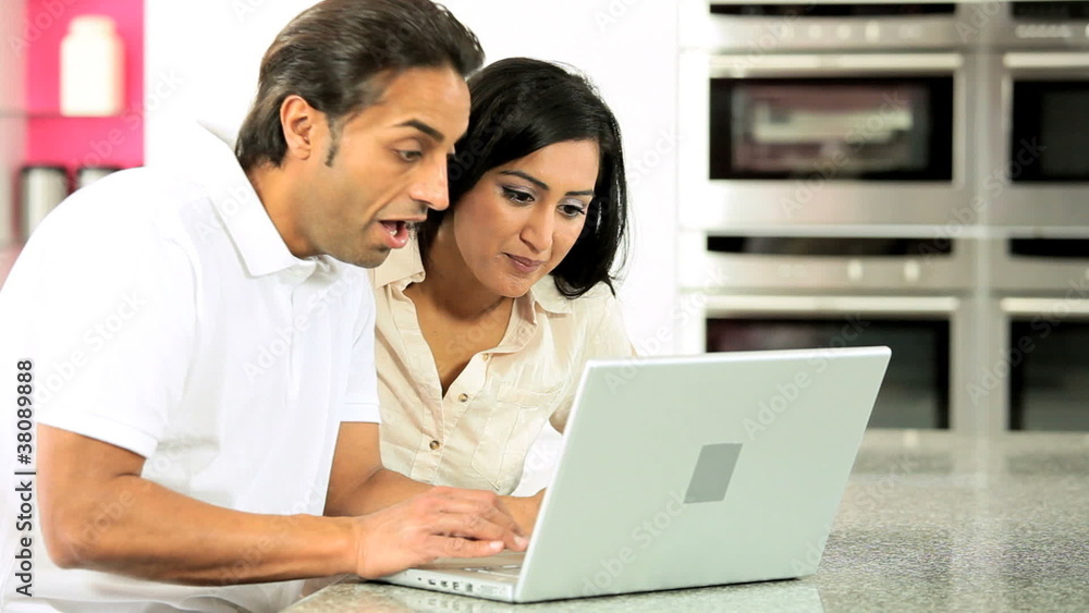 Asian Couple with Laptop Having Success Online Asian Couple with Laptop Having Success Online