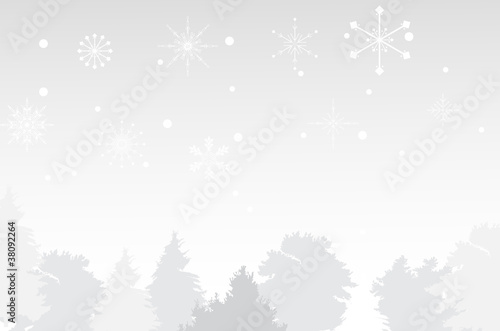 grey background with trees under snowflakes photo