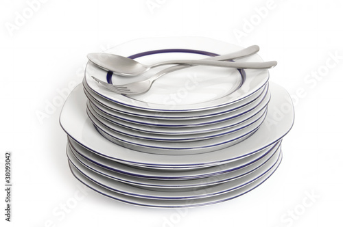 A stack of plate, knife and fork