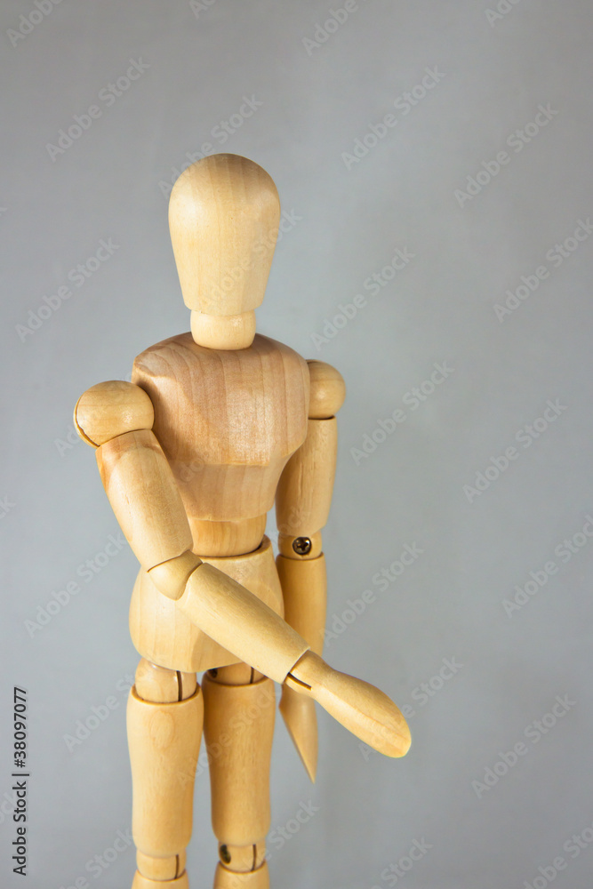 A wooden mannequin give a hand, greets A wooden mannequin give a hand, greets