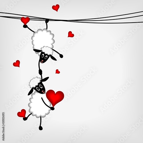 two sheep with red hearts