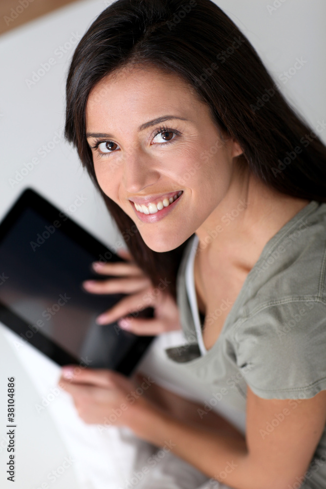 Young smiling woman using electronic tablet Young smiling woman using electronic tablet
