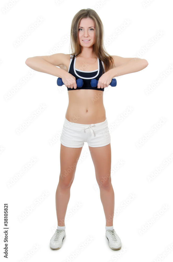 The girl does exercises with dumbbells The girl does exercises with dumbbells