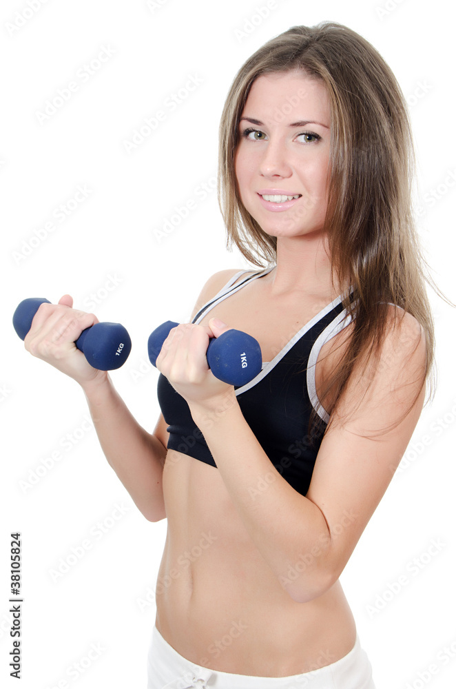 The girl does exercises with dumbbells The girl does exercises with dumbbells