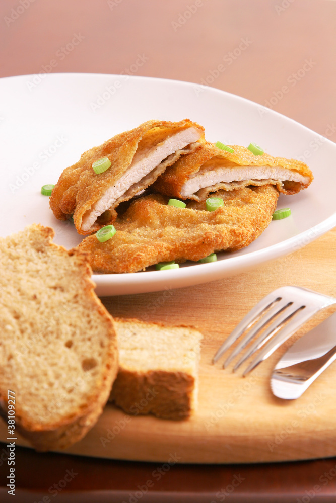 Breaded chicken with cutlery