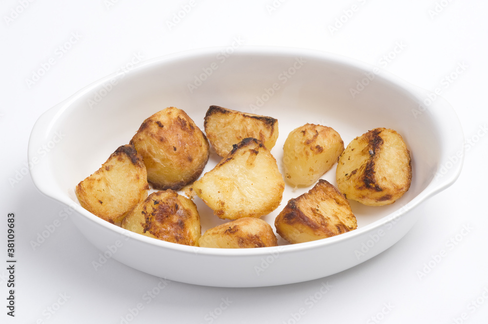 roasted potatoes in a white oven dish roasted potatoes in a white oven dish