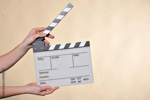 hands with clapperboard