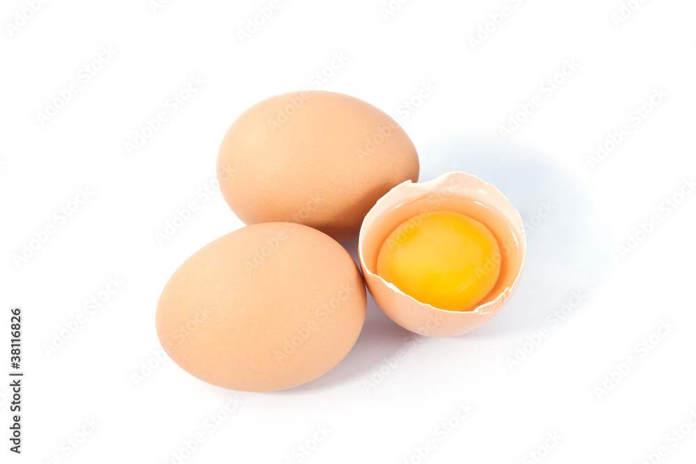 eggs on a white background. One egg is broken