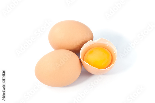 eggs on a white background. One egg is broken