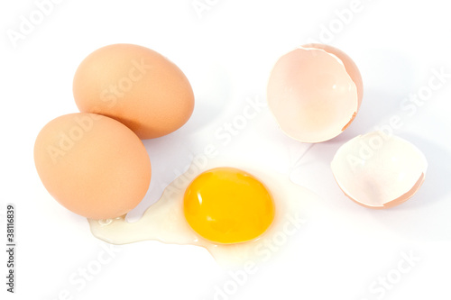 eggs on a white background. One egg is broken.