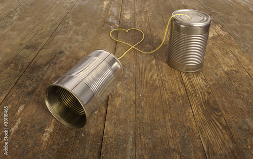 tin can phone with heart shape in wire
