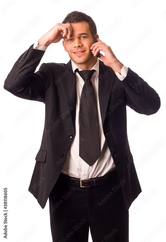 young business man on the phone looking upset. young business man on the phone looking upset.