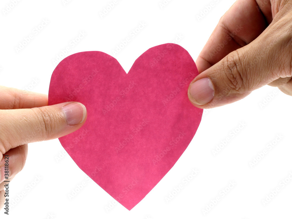 Two hand hold a pink heart on white background Two hand hold a pink heart on white background