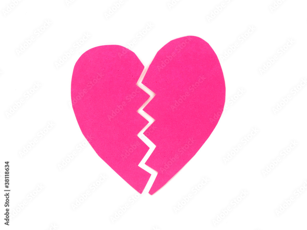 Broken pink heart on white background