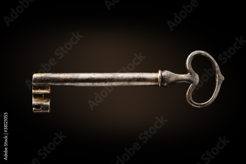 old key on dark background © stokkete