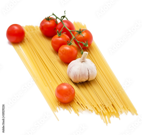 Spaghetti and tomatoes on a white background