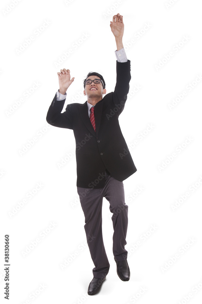 Businessman with a climbing pose