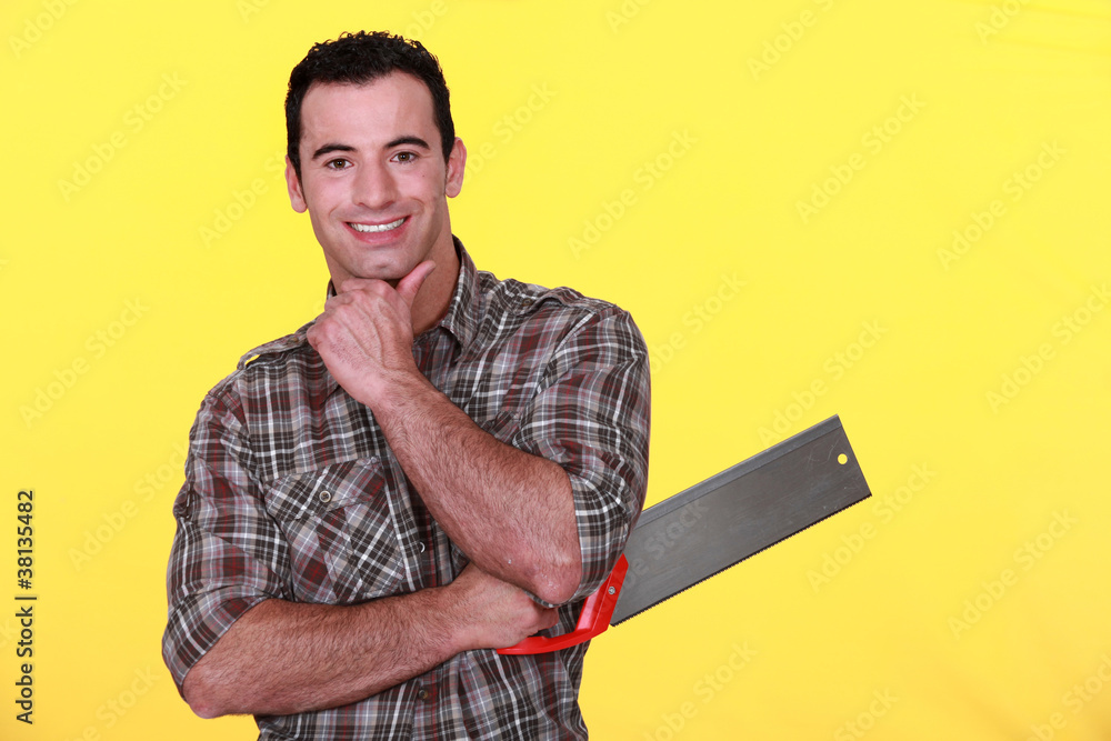 Man holding a backsaw Man holding a backsaw