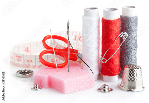 tools for needlework thread scissors and tape measure isolated photo