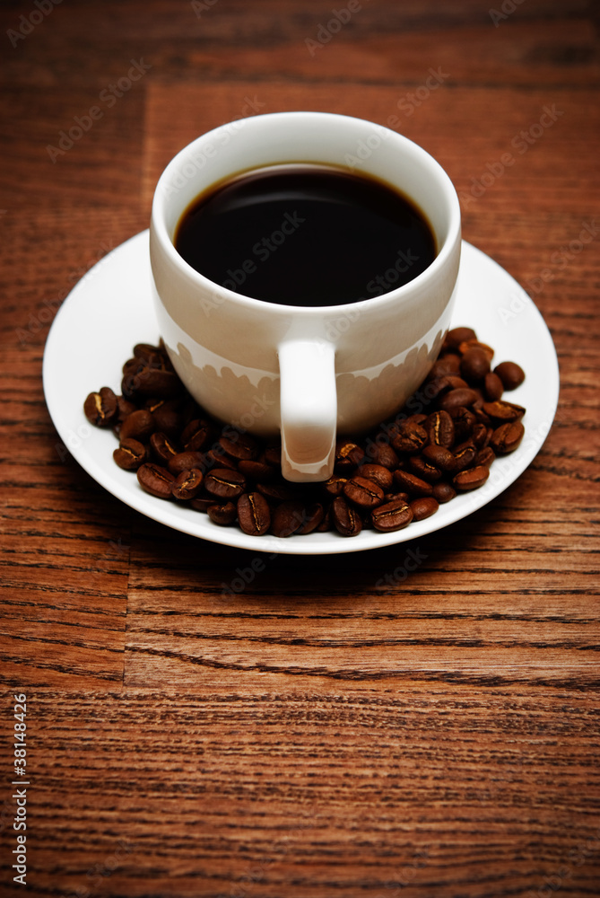 cup of coffee on a wooden table cup of coffee on a wooden table