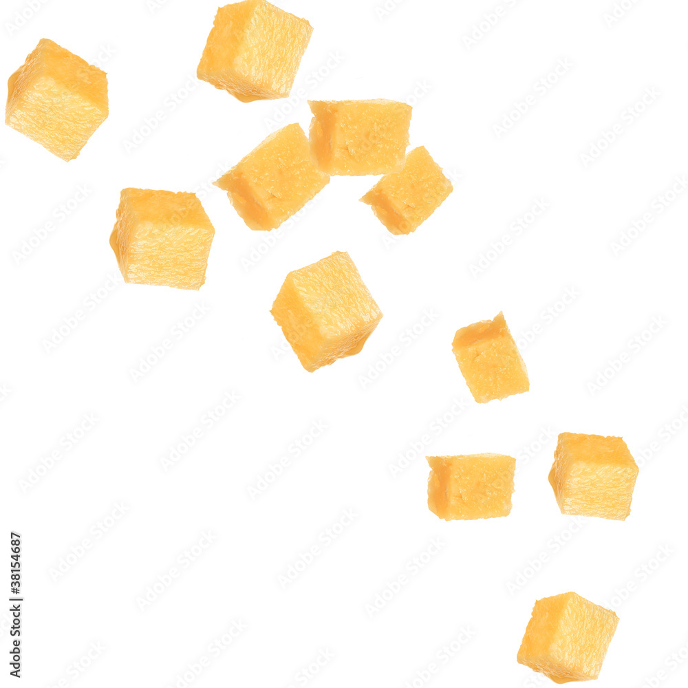 Pine apple cubes falling over white background