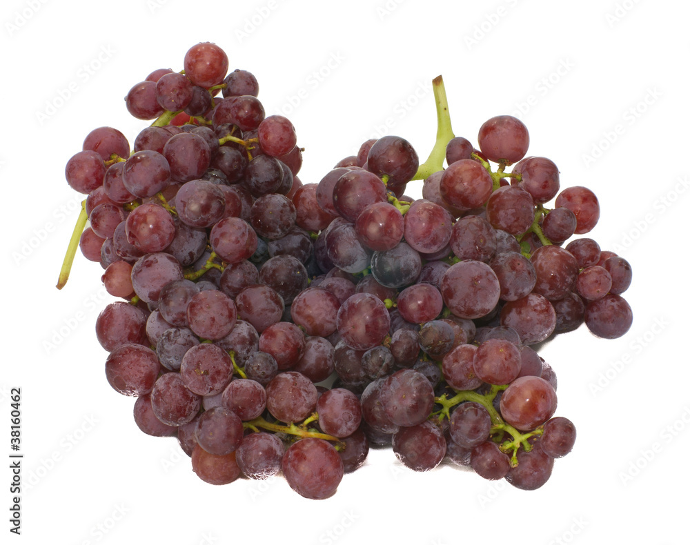 Fototapeta premium Fresh red seedless grapes isolated on white