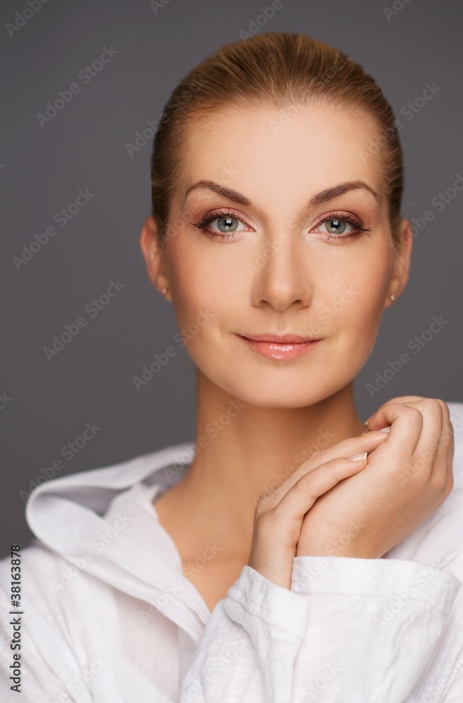 Beautiful woman isolated on grey bakground. Beautiful woman isolated on grey bakground.