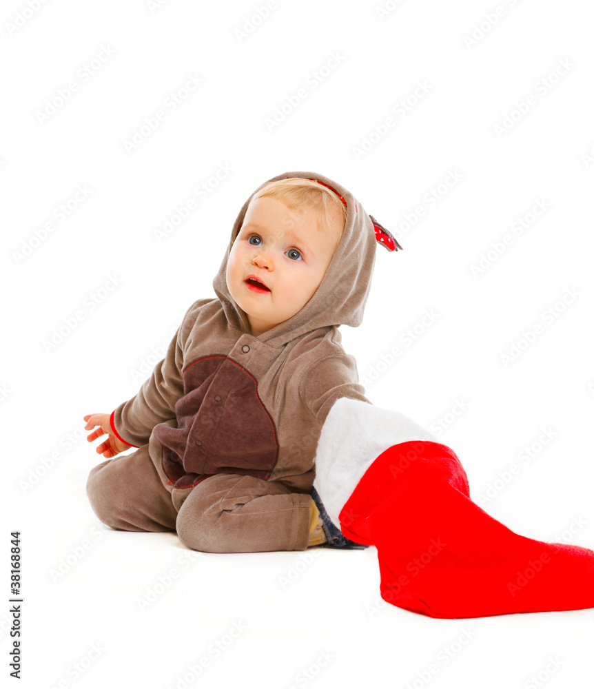 Curious adorable baby look what's inside of Santa sock Curious adorable baby look what's inside of Santa sock