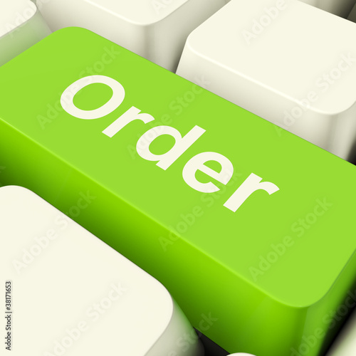 Order Computer Key In Green Showing Online Purchasing And Shoppi photo