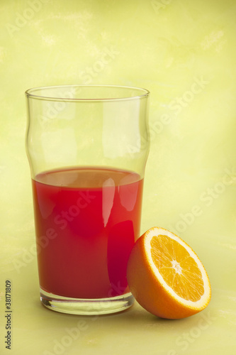 Wallpaper Mural orange juice with oranges on green background Torontodigital.ca