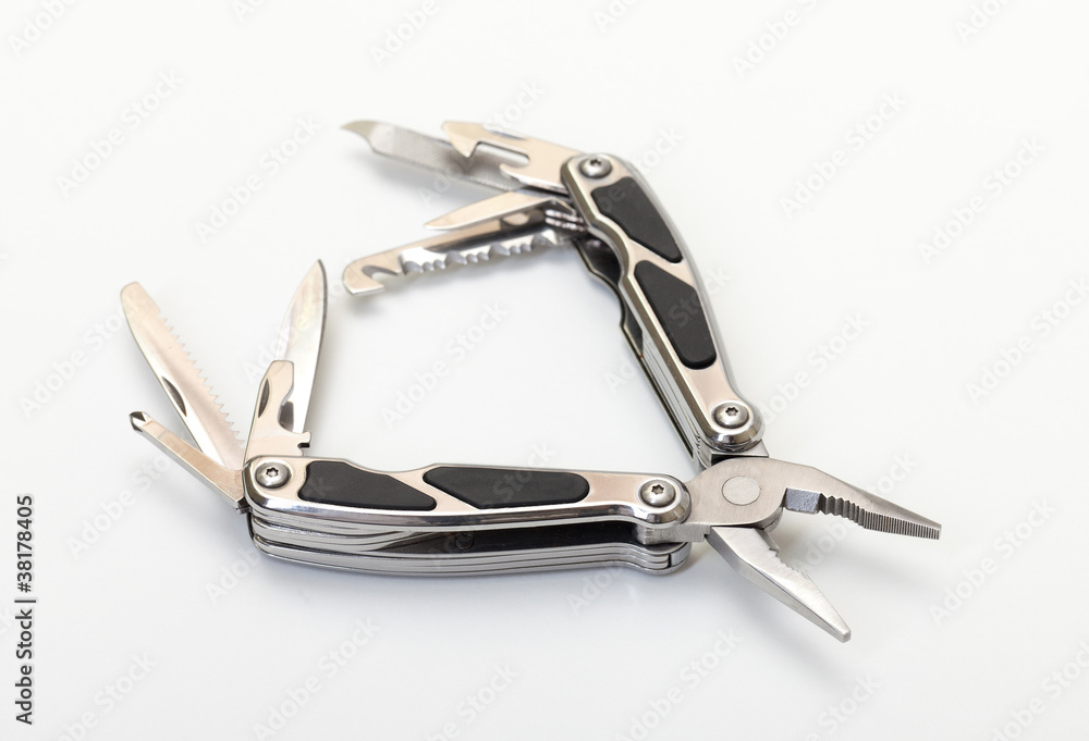 Steel pliers folding multi tool opened on white background Steel pliers folding multi tool opened on white background