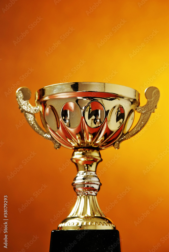 Trophy cup on orange background Trophy cup on orange background