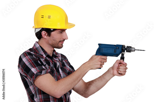 craftsman holding a drill