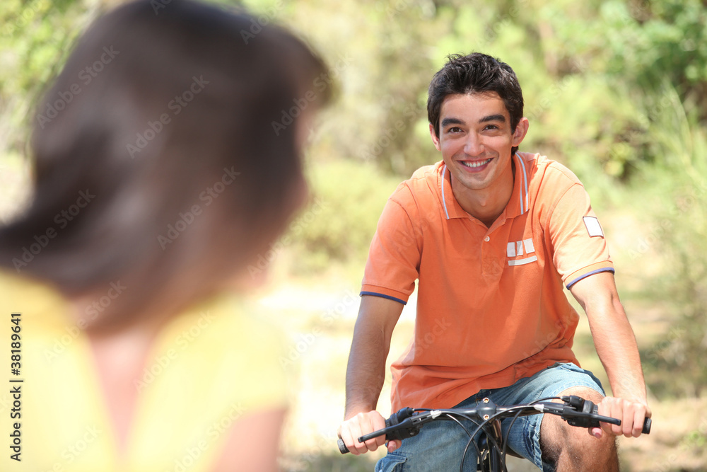 Couple riding bikes Couple riding bikes