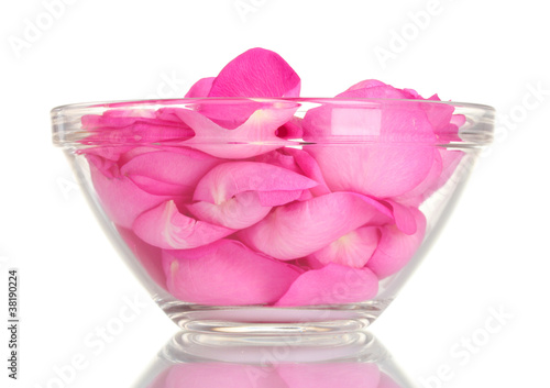 beautiful pink rose petals in glass bowl isolated on white