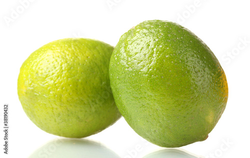 two ripe limes isolated on white