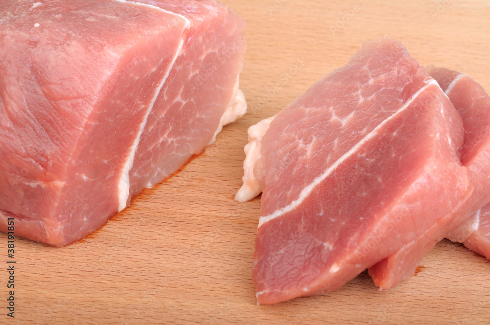 pieces of meat on a wooden board