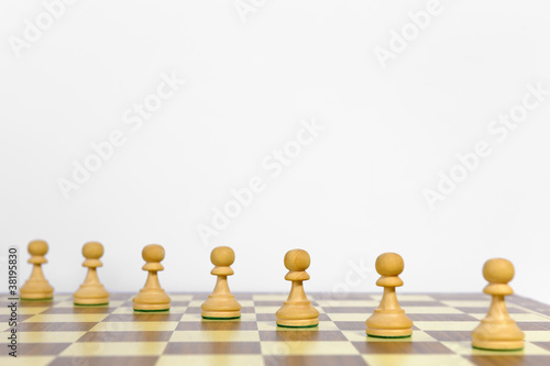 Playing pawns diagonally on a chessboard  white background