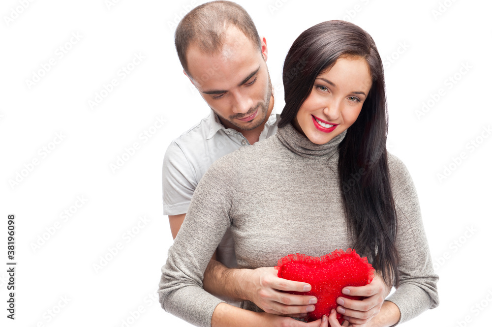 Happy young adult couple with red heart on white background, emb Happy young adult couple with red heart on white background, emb