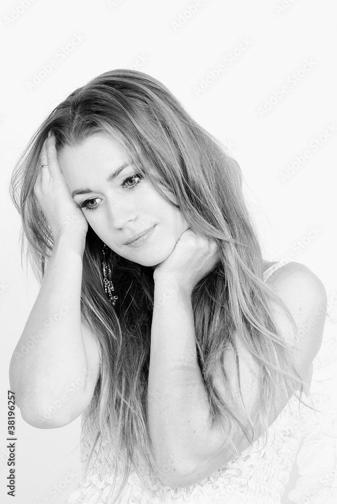 The young beautiful girl an angel with wings on a white backgrou The young beautiful girl an angel with wings on a white backgrou