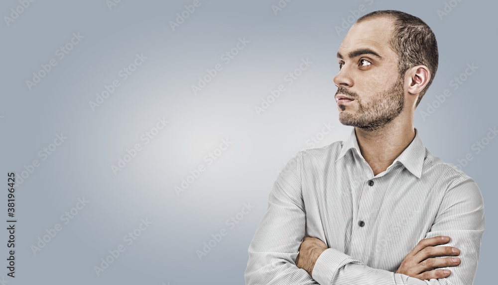 Fashion young businessman on gray background Fashion young businessman on gray background