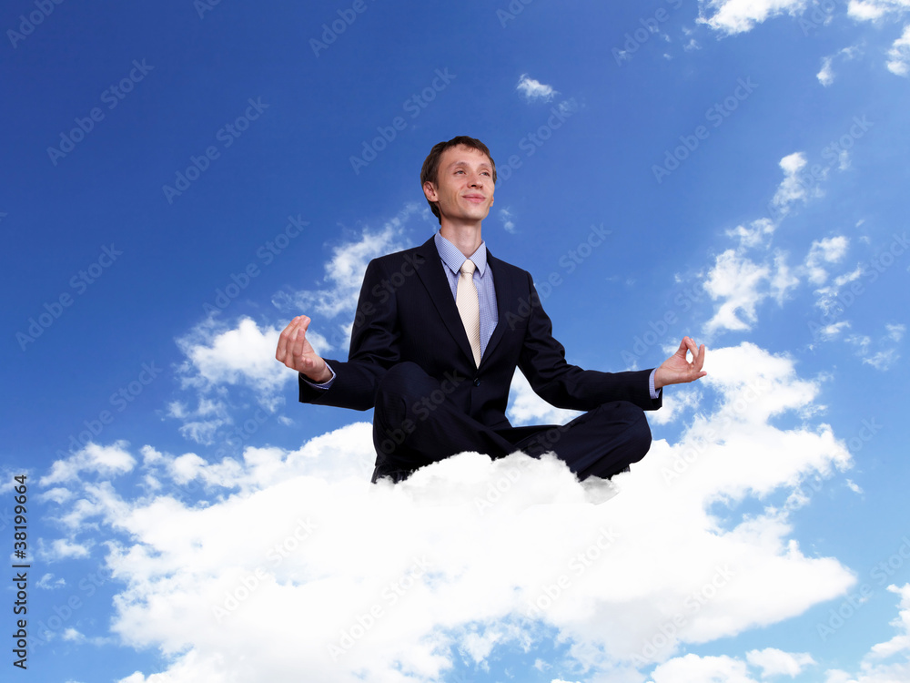 Young businessman sitting and praying Young businessman sitting and praying