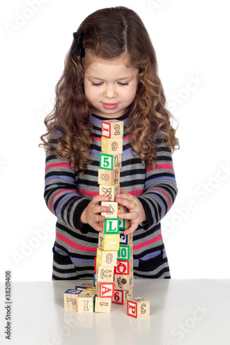Adorable baby playing with wooden blocks photo