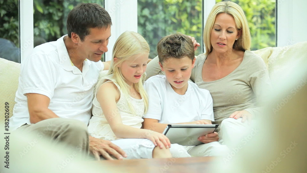 Caucasian Family Playing on Wireless Tablet Caucasian Family Playing on Wireless Tablet