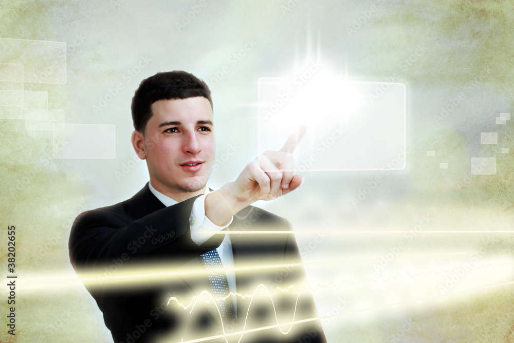 Young business man selecting a touch screen button Young business man selecting a touch screen button