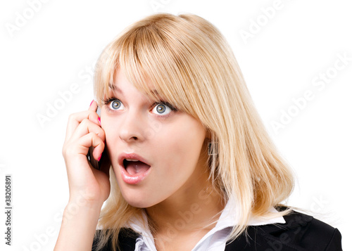 amazed blonde girl talking on phone