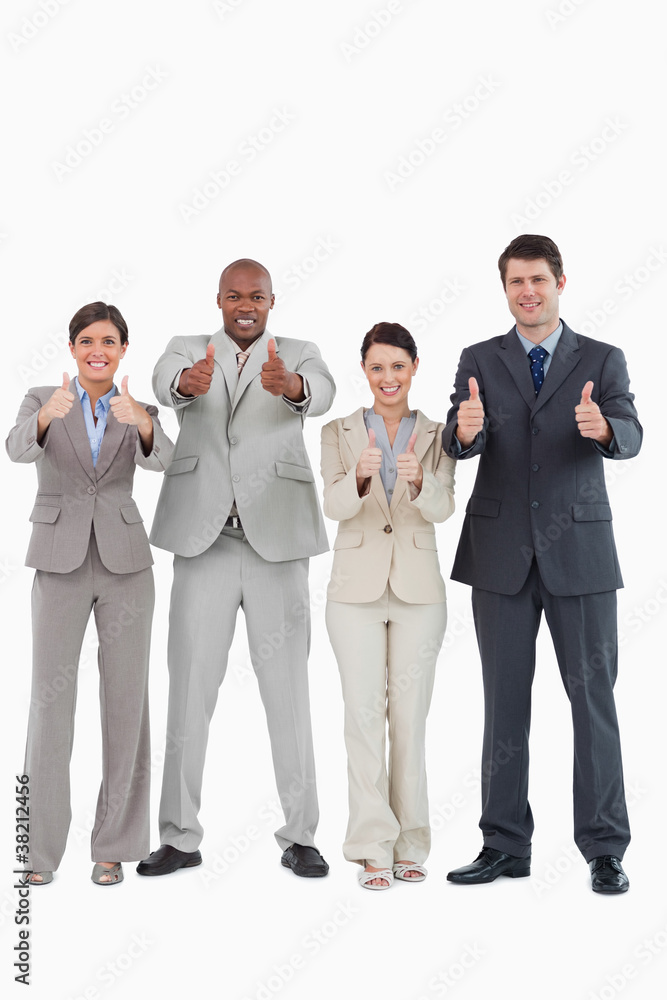 Businessteam giving thumbs up together Businessteam giving thumbs up together