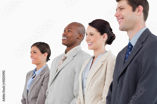 Side view of smiling businessteam standing together